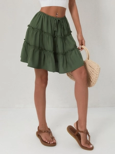 Detailed close-up of army green layered mini skirt featuring a high waist and adjustable drawstring