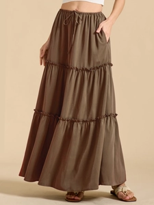 Detail view of high waist tiered maxi skirt in olive brown with elastic drawstring waist
