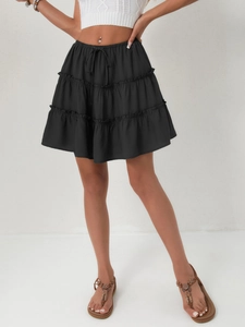 Close-up of black tiered mini skirt featuring elastic waistband and lace-up drawstring