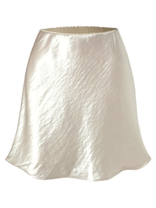 Elegant champagne satin A-line mini skirt with a textured glossy finish and elastic waist