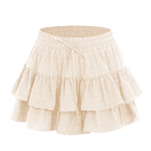 Detailed view of beige layered ruffle mini skirt with swiss dot fabric and elastic tie waist