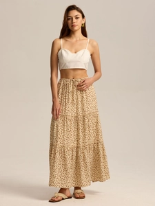 Detail of high waist floral tiered maxi skirt with adjustable drawstring and pockets