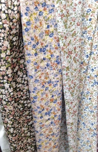 Close-up of various floral print fabric patterns for lightweight summer skorts and skirts