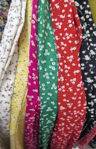 Detail showing various colors of floral pattern textile fabric for summer skorts