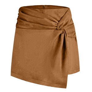 Detail showing the faux suede fabric texture and side knot design on the caramel mini skort