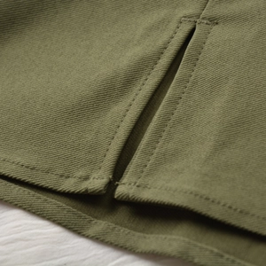 Detail shot of the olive green fabric with twin-needle stitching and twill texture finish