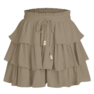 Detail of khaki layered ruffle skirt with elastic waist, drawstring and wooden beads