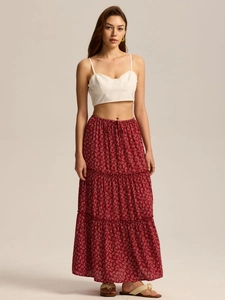 Detail of high waist floral tiered maxi skirt with adjustable drawstring and pocket