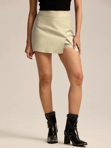 Detail view of high-waist stretch skort showing the mini slit and faux suede texture