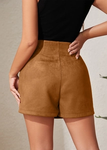 Rear view of brown high-waisted suede skort showing stitching details and bodycon fit