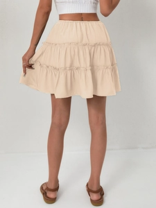 Detail view of the high-waisted beige tiered ruffle skirt with three layers and A-line cut