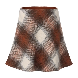 Close-up of brown plaid wool A-line skirt with detailed herringbone tweed texture