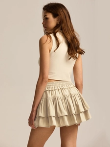 Detail shot of white layered ruffle skort and high waist drawstring design for summer