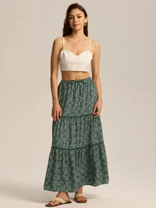 Detail of high waisted green floral maxi skirt with adjustable drawstring waist and tiered hem