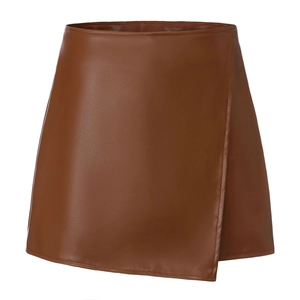 Detail of the high-waist faux leather wrap skirt with fine stitching and coffee brown texture
