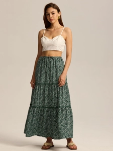 Detail of high waist floral tiered skirt with adjustable drawstring and white crop top