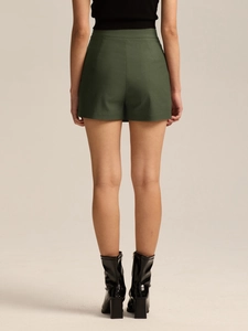 Rear view of dark green high waist skort with clean lines and smooth elastic fabric