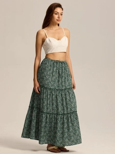 Detail view of high waisted floral tiered skirt with drawstring and white crop top