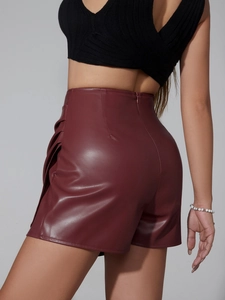Detailed view of burgundy PU leather high waist skort with side pleats and rear zipper