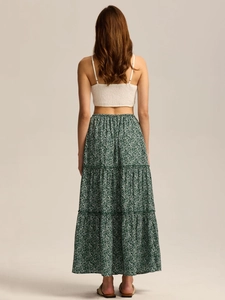 Back view of high waist floral tiered maxi skirt with elastic waist and smocked white top