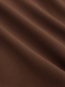 Macro shot of high-waisted skort featuring brown twill woven fabric with soft texture