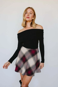 Detail view of high waist red and black plaid A-line mini skirt with soft wool texture