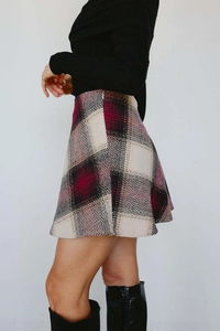 Detailed view of plaid wool skirt fabric texture and side invisible zipper closure