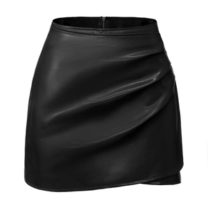 Detail of high waist black faux leather mini skirt showing wrap style ruffles and texture