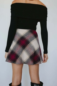 Detailed back view of a high-waisted red and white plaid wool A-line mini skirt for women