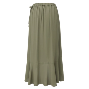 Detailed view of elastic waist and ruffle hem on long green wrap skirt fabric