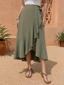 Detail of army green wrap skirt with ruffled edges and lightweight chiffon fabric