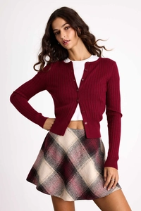 Detailed macro shot of the red checkered high-waist A-line skirt with a plaid pattern