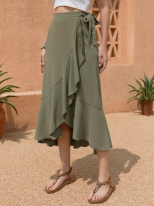 Detail of army green wrap skirt featuring ruffle hem and side tie bow on the waist