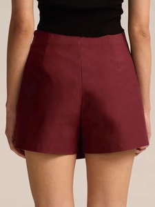 Rear view of wine red high waist asymmetric skirt pants in premium suiting fabric