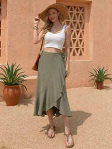 Detail of olive green wrap skirt with ruffle hem and high waist for resort wear fashion
