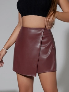 Detail view of the deep red PU leather wrap mini skirt with high waist design