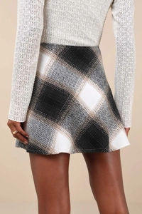 Detailed back view of a high-waisted plaid wool mini skirt with a classic A-line silhouette