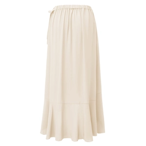 Detailed view of elastic gathered waist and ruffled hem on a beige midi wrap skirt