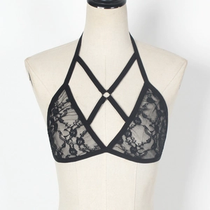 Detail of black floral lace bralette with harness straps and metallic ring connector