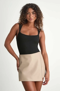 Detail of high waist beige faux leather wrap skirt with vertical stitching and zipper