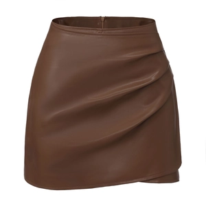 Close-up of side drawstring ruching and wrap asymmetrical hem on brown PU leather skort