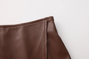 Detailed close-up showing the premium stitching and texture on brown PU leather skirt
