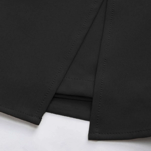 Detail view of high waist skort featuring a side slit and precise stitching on black fabric