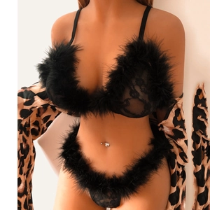 Close-up of black lace lingerie set featuring plush feather trim and leopard print robe