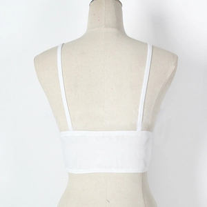 Detailed back view of a white lace camisole with thin adjustable spaghetti straps