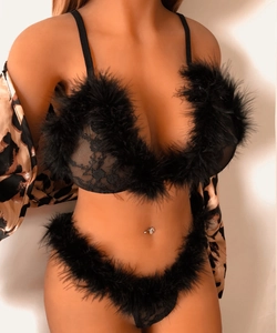 Close-up of black lace lingerie set with feather trim and leopard print silk robe