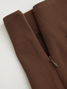 Macro detail of high-quality brown twill fabric with matching invisible water-drop zipper