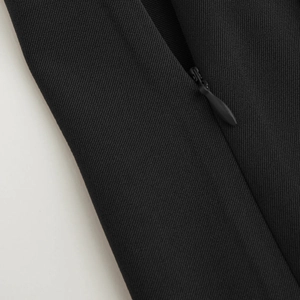 Detail shot of black high waist skort featuring hidden zipper and twill fabric texture