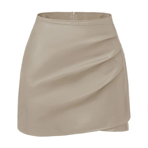 Detail shot of apricot PU leather mini skirt showing ruched texture and side zipper