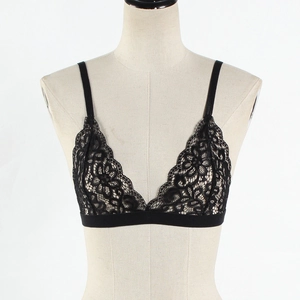 Close-up detail of black floral lace bralette with wireless triangle cups and elastic band